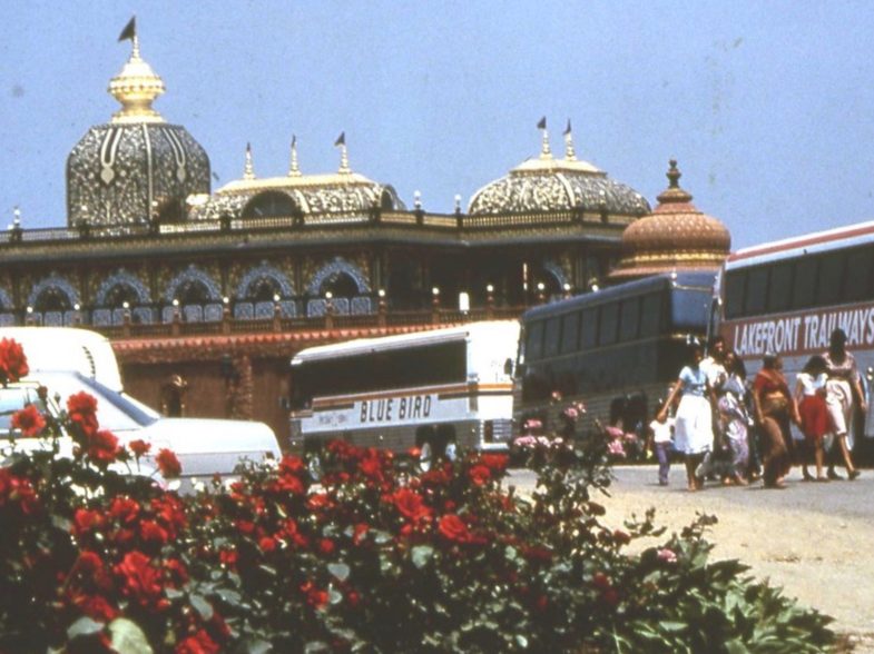 Tourists and pilgrims arrive at the Palace of Gold, c. 1980s