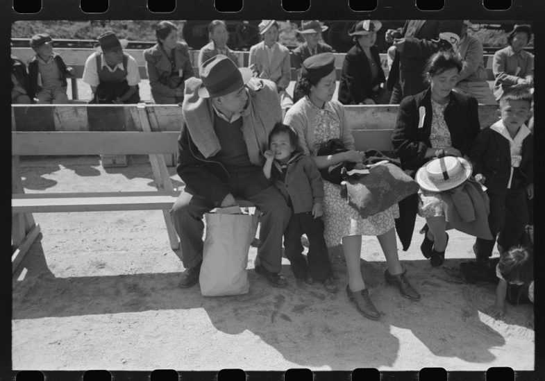 Untitled photo, possibly related to: Santa Anita reception center, Los Angeles, California. The evacuation of Japanese and Japanese-Americans from West Coast areas under U.S. Army war emergency order. Waiting for registration, 1942. Photograph by Lee Russell. 