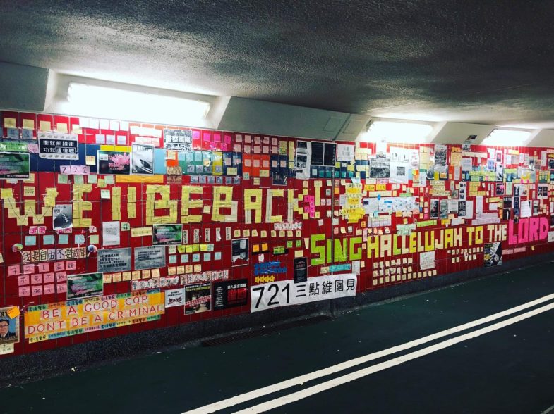 Fig. 1 Post-it notes and posters of protest slogans cover the wall of a pedestrian underpass. Protesters used post-it notes to lay out “Sing Hallelujah to the Lord.” Photo by Clara Ma