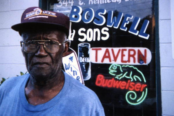 Mr. Boswell standing in front of his tavern at 344 E. Kennedy Blvd. in Eatonville, Florida. (2001) via Florida Memory: State Library and Archives of Florida, Folk Life Collection