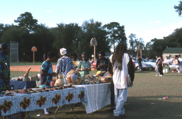 People displaying their craft items at the Zora Neale Hurston Festival of the Arts and Humanities - Eatonville, Florida (1990) via Florida Memory: State Library and Archives of Florida, Folk Life Collection